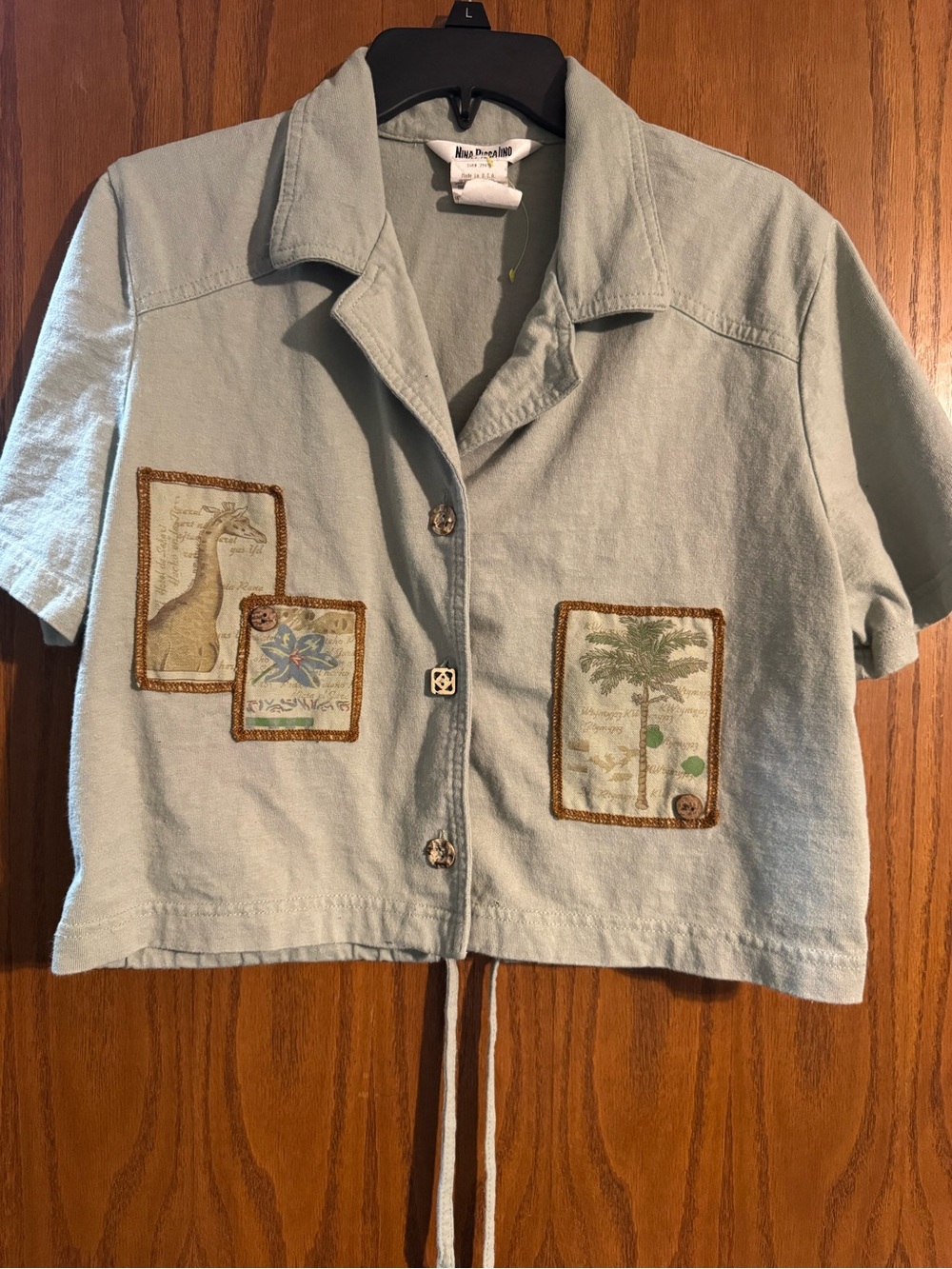 Nina Piccalino Pale Blue Short Sleeve Button-Down Shirt with Nature Patchwork